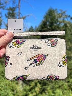 COACH White Pebble Leather Rocket Print Wristlet
Wallet with Silver Hardware NWT